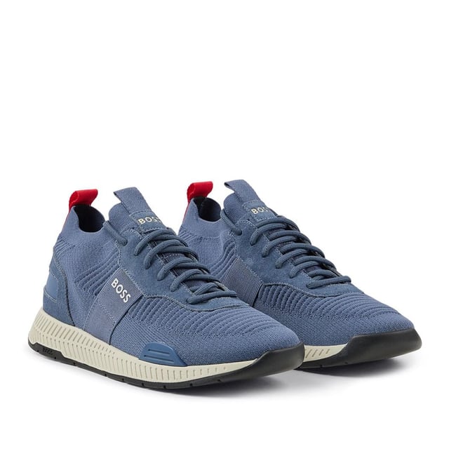 Mens BOSS Titanium Running Trainers in blue.- Stretchy knitted upper.- Lace up fastening.- Pull tabs on the collars and tongues.- Signature BOSS lettering to the heels  tongues and lateral sides.- Rubber sole.- Ref: 50470596-438
