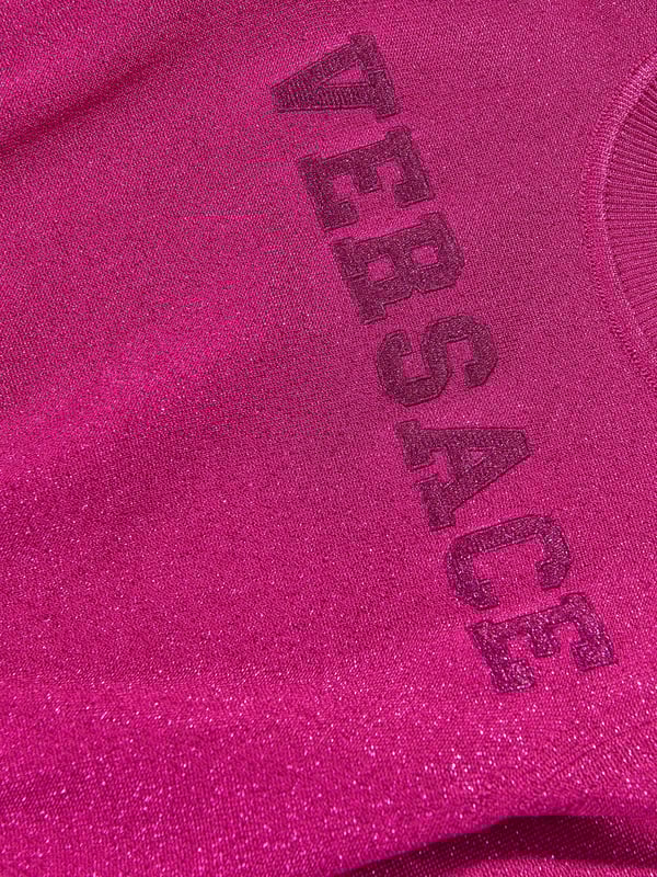 Introducing Versace's Girls Logo Knitted Sweater, a trendy and luxurious touch for your little one's wardrobe. Here are the top features: Italian Craftsmanship: Expertly crafted in Italy, signifying exceptional quality and longevity.Designer appeal: The iconic Versace logo print injects fun and high-fashion flair, turning this staple into a statement piece.Comfort Maximized: Fabricated from superior fabrics, assures a soft, cosy and breathable wear for all-day comfort. Updated Look: Amplify your girl's fashion statement with the chic Pink colour of this essential Versace sweater. Order today for a stylish, standout look.