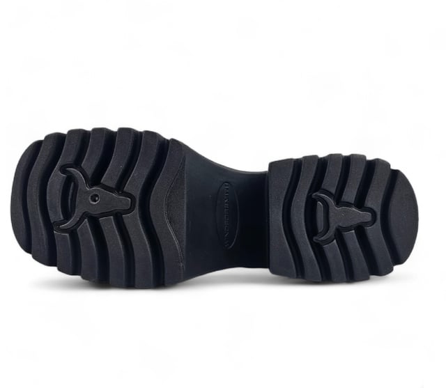 Step into bold fashion with the Totally Black Platform Boots, designed to make a statement with every stride. These chunky lace-up boots feature a robust black leather upper that exudes confidence and style. The round toe design and eye-catching bull symbol on the upper add a unique flair, while the inside zipper ensures easy wear.

Key Features:

Chunky Heel and Platform: A striking heel height of 9 cm combined with a 4.6 cm platform gives you an elevated look without sacrificing comfort.
Durable Black Leather Upper: Crafted from high-quality black leather, these boots provide both style and durability for everyday wear.
Lace-Up Design: The adjustable lace-up feature allows for a customizable fit, ensuring both comfort and security.
Cleated Sole: The cleated sole provides excellent grip and traction, making these combat boots perfect for any terrain.
Non-Leather Lining: Designed with a non-leather lining for enhanced breathability and comfort during all-day wear.
Whether you're dressing up for a night out or adding edge to your casual look, the Totally Black Platform Boots are the perfect blend of style and practicality. Embrace your inner warrior and make every outfit a bold fashion statement!