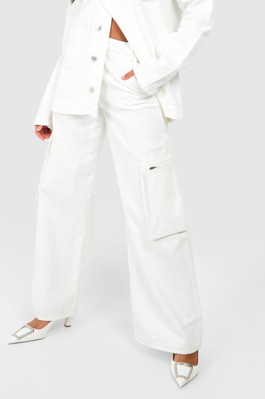 Wide-leg design for a relaxed, on-trend silhouette
        Cargo-style pockets add a utilitarian edge
        High-waisted fit for a flattering shape
        Zip-detail pocket for secure storage and added style
        Versatile denim fabric suitable for various casual occasions
    
    Make a bold statement with these eye-catching denim cargo trousers. The wide-leg cut offers a contemporary twist on classic jeans, whilst the high-waisted design accentuates your curves. The standout feature is the zip-detail pocket, adding both practicality and an edgy aesthetic. Perfect for the fashion-forward woman who values both style and functionality, these trousers can be dressed up or down with ease. For a chic daytime look, pair with a cropped jacket and sleek trainers, as seen on our model. Alternatively, style with a fitted bodysuit and heeled mules for an evening out with friends. The denim fabric ensures comfort and durability, making these trousers a versatile addition to your wardrobe for family gatherings, casual outings, or relaxed weekends about town.