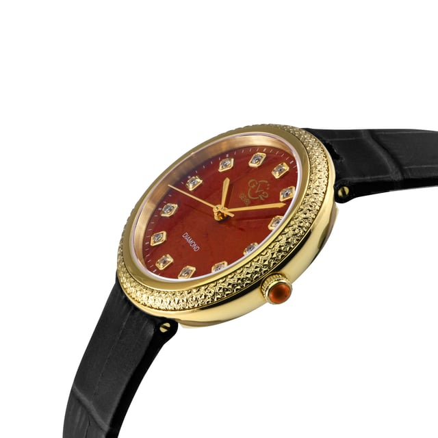 Introducing the Red Jasper Radiance Dial - a horological masterpiece inspired by the captivating charm of Arezzo, where age-old craftsmanship intertwines with the splendor of nature. Skillfully fashioned with the finest red jasper stone, it unveils an exquisite blend of warm hues, echoing the sun-kissed landscapes that grace this enchanting city.



Rooted in Arezzo's artistic legacy, this dial exemplifies the mastery passed down through generations. Each gradient reflects the city's creative essence, as the hands move with grace, marking the eternal flow of time in captivating rhythm.



Yet, the Red Jasper Radiance Dial transcends aesthetics, as it is believed to emanate remarkable metaphysical powers. Embrace the potent energy of red jasper, as it ignites a fiery spark of vitality, grounding its wearer with strength, courage, and renewed passion.



Like the fiery Tuscan sunsets that adorn the horizon, this exquisite stone radiates with the nurturing energies of the earth, fostering inner balance and a profound sense of well-being.

Let the Red Jasper Radiance Dial be a symbol of the harmonious connection between human ingenuity and nature's marvels. Embrace the mystical wisdom of red jasper, as it weaves a tapestry of vibrant elegance and empowerment around your wrist.



Journey through time, guided by the enchanting allure of the Red Jasper Radiance Dial, where the essence of Arezzo's heritage intertwines seamlessly with the eternal river of time. Elevate your existence and celebrate the harmonious union of art, history, and natural wonder, embodied in this horological masterpiece from the heart of Arezzo. Embrace the invigorating aura of red jasper, and embark on a profound voyage of self-discovery, led by the spirit of this magnificent city.





GV2 13303 Womens Arezzo Swiss Made Diamond Watch

GV2 Womens Swiss Diamond Watch from the Arezzo Collection
33mm round IPYG Case, Diamond Cut Bezel
Red Jasper Dial, 12 Diamonds
Push Pull crown with Red Jasper Cabochon
Genuine Italian Red Handmade Leather Strap with Tang Buckle
Anti-reflective Sapphire Crystal
Water Resistant to 50 Meters/5ATM
Swiss Quartz Movement Ronda 763