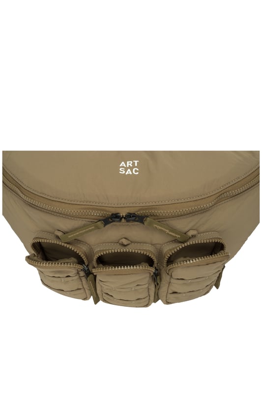 The perfect practial edition to any outfit. This unique triple-pocket design sling bag has enough internal and external space to carry all your every day essentials. Features: , Padded lightweight nylon, Water resistant, Zip top opening to main compartment, ARTSAC screen printed logo, Triple front zip pocket with loops, Internal zip pocket, External rear zip pocket, Top grab handle, 2 Mobile phone internal net pockets, Adjustable shoulder strap allowing backpack styling or bum bag styling Style Ref: 52014 SAND
