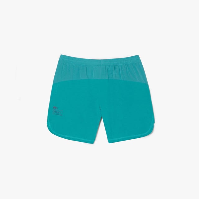 Men’s Lacoste Sport Check Stretch Mesh Shorts Relaxed  loose cut: Comfortable and fluid. Wide waistband with drawstring closure: Great for all body types. Zipped side pockets: Keep your essentials safe. Green silicone crocodile: The hallmark of excellence. Stretch taffeta and mesh: Breathable fabric for optimal ventilation.