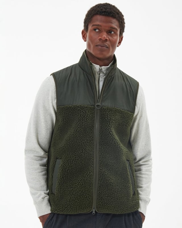 Barbour Newlan Fleece Gilet
A layering essential for the cooler months of the year, the Barbour Newlan Fleece Gilet is made from soft faux fur for a cosy look and feel. Boasting contrast panelling to the upper yoke and collar, it comes with lower welt pockets and tonal lycra binding to keep out the chill.

Barbour embroidery to left pocket
Main fabric (faux fur): 100% polyester
Secondary fabric: 100% polyester
Filling: 100% polyester
Machine wash 30?C
Back length: 70.5cm - 76.5cm

MFL0171