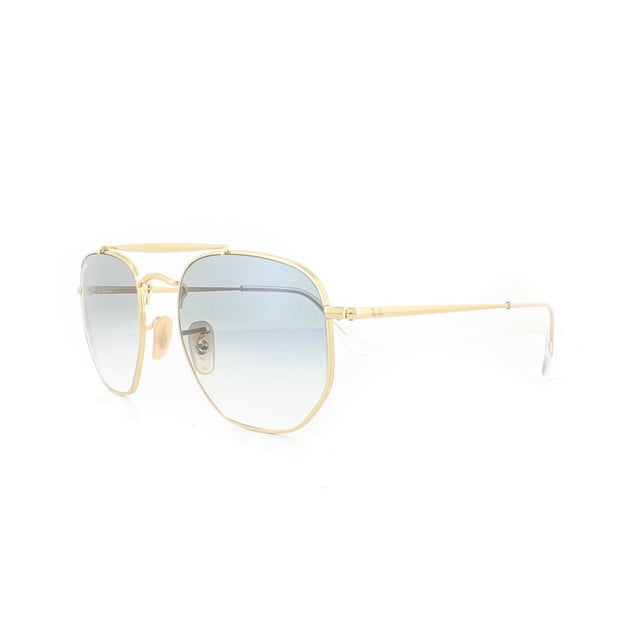 Las gafas de sol Ray-Ban Marshal 3648 001 / 3F Gold Light Blue Gradient son una versión única del estilo Aviator con montura hexagonal redondeada que aporta nuevos ángulos y un look contemporáneo a la moda. El doble puente añade más encanto y estilo y las patillas planas rematan la montura a la perfección.
