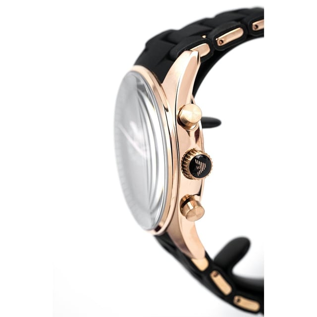 Japanese Made Quartz Chronograph Movement. 38mm Rose Gold PVD Plated Stainless Steel Case. Solid Caseback. Black Dial. Luminous Stainless Steel Hands. Printed Indexes. Date between 4 and 5 O'Clock. 20mm Black Silicone Coated Stainless Steel Bracelet with Stainless Steel Butterfly Clasp. Water Resistant to 50 Meters 5ATM. This watch is and comes with the correct Box and Paperwork.