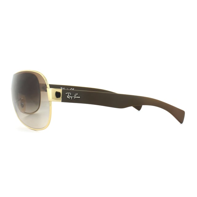 Ray-Ban Sunglasses 3471 001/13 Gold Brown Gradient are a super cool visor sunglass with thick arms and a matt finish for a trendy update to the classically shaped visor frame.