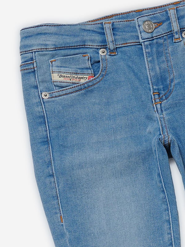 Diesel envision stunning innovative properties in their sleek silhouettes. These girls jeans embody the label's rebellious spirit by experimenting with bold, distinctive styles. Crafted in a bootcut style with a low waist and higher back coverage. This classic slim jean with a bohemian attitude hugs the body from the hips to the knees. Crafted from JoggJeans¬Æ fabric for the utmost comfort. They are in a clean light blue finish, enriched with a super-stonewashed treatment, broken details, frayed hems and contrasting-colour stitching. 65% Cotton, 30% Polyester, 5% Elastane