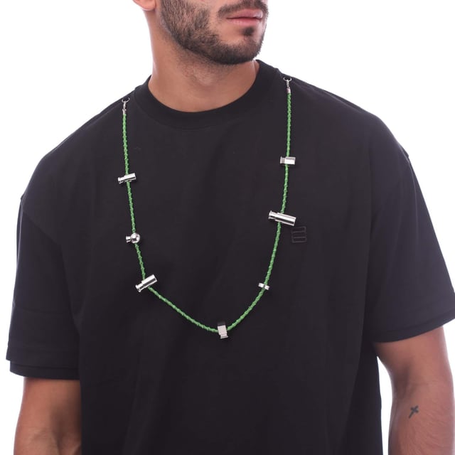 Ambush Stoppers T- Shirt in black green.- Crewneck.- Short sleeves.- Detachable cord necklace with stopper detailing.- Embroidered logo at left chest.- 100% Cotton.- Ref: BMAA0550011055
