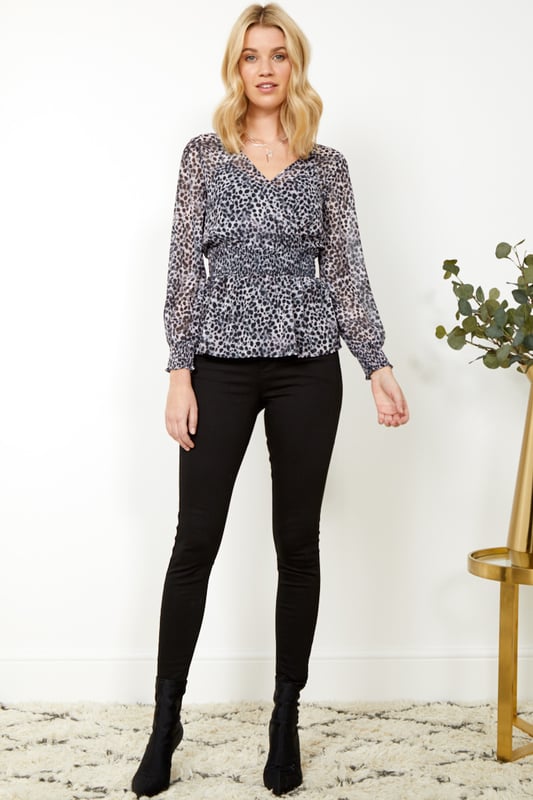 REASONS TO BUY: It'll transform your jeans and trousersYour new animal print fixFaux wrap front won't fall openOn-trend shirred waist: it's super-flatteringSexy sheer sleevesJust add white skinnies.