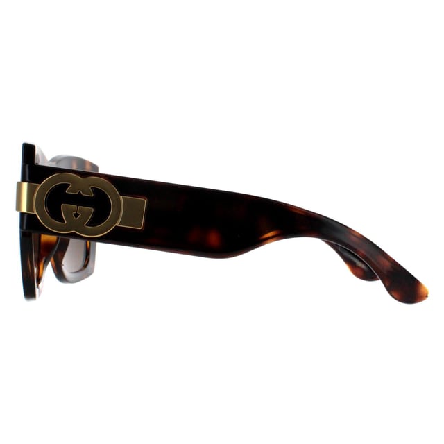 Gucci Square Womens Dark Havana with Gold Brown GG1688S  Sunglasses offer a perfect combination of modern sophistication and understated luxury. With their bold, square frame, these sunglasses make a striking fashion statement while maintaining a timeless appeal suitable for various occasions. The design is complemented by Gucciâ€™s signature double-G logo on the temples, adding a touch of iconic branding that speaks to the wearerâ€™s impeccable taste. High-quality lenses provide essential UV protection, ensuring comfort and safety without compromising on elegance.
