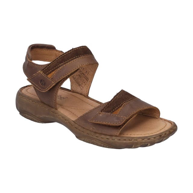 Mit der Debra 19 Sandale von JOSEF SEIBEL, in der Farbe castagne/kombi, erlebst du den Sommer von seiner besten Seite. Dieser Damenschuh vereint traditionelle Handnaht mit modernem Design und bietet durch die PU-Sohle außergewöhnliche Dämpfeigenschaften, die jeden Schritt leicht machen. Das Obermaterial sowie das Fußbett aus Leder garantieren ein angenehmes Tragegefühl und machen die Sandale zum idealen Begleiter für jegliche Freizeitaktivitäten im Freien. Dank des praktischen Klettverschlusses lässt sie sich schnell an- und ausziehen. Die Debra 19 ist ein Paradebeispiel für Slow Fashion, geprägt von der Spirit of Nature Kollektion, die für ihren charakterstarken Designansatz und den hohen Tragekomfort steht. Entdecke, wie dieser Schuh mit seiner einzigartigen Fertigungsart echte deutsche Industriekultur verkörpert und setze ein Statement gegen Fast Fashion.