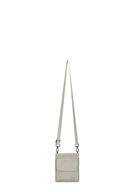 The perfect daily companion for carrying all your essentials. The Portrait Nylon Crossbody Bag features two internal main compartments, a flap over zip pocket to the front and fully adjustable strap with a clip off function. Features: , Zip top opening, Front flap over zip pocket, Rear zip pocket, SMITH & CANOVA antique brass logo, Branded antique brass zips, Adjustable crossbody strap (detachable), Two internal main compartments, Internal zip pocket Style Ref: 92685 STONE