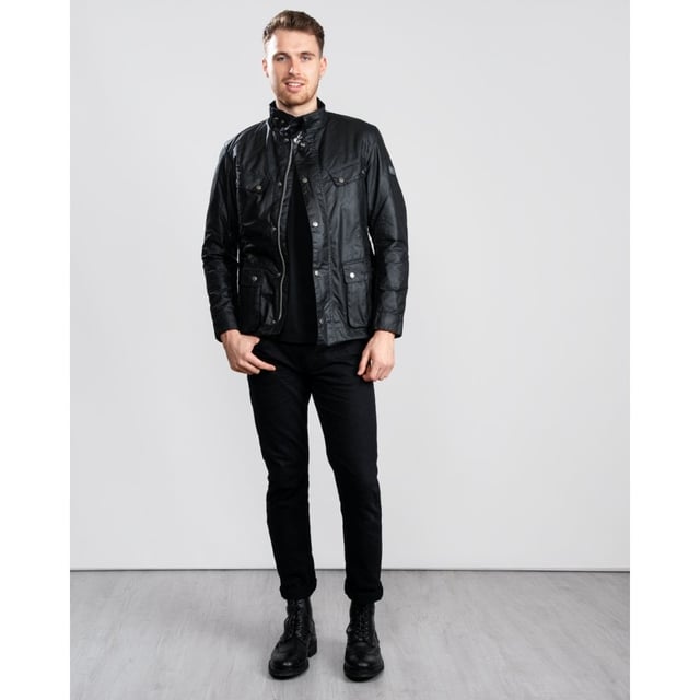 A mainstay of the World Tour collection, the Duke is a re-work of the iconic Enfield jacket in a winter-ready waxed cotton.
With biker styling and a robust construction, the Duke is crafted in Barbour&rsquo;s 6oz Thornproof wax for durable protection with a lustrous finish, complete with a two-way zip and hardy studded storm fly front. A quilted nylon lining adds warmth, while the cosy funnel collar and stud-fastening cuffs boast a contrast corduroy lining for incredible softness and a signature Barbour look.
Paying homage to Barbour&rsquo;s motorcycle heritage, authentic detailing includes elbow patches, four studded pockets and a collar strap. The lower bellow pockets feature a stylish pleat and are generously proportioned to carry essentials without adding bulk, while a zipped inner pocket safeguards valuables. Available in four versatile colours with the Barbour International badge to the sleeve, the Duke is subtly tailored with a relaxed fit ideal for winter layering.

Back length: 28.5–32" | 71.5–81.5cm
Mediumweight 6oz Thornproof wax outer
Sponge clean only