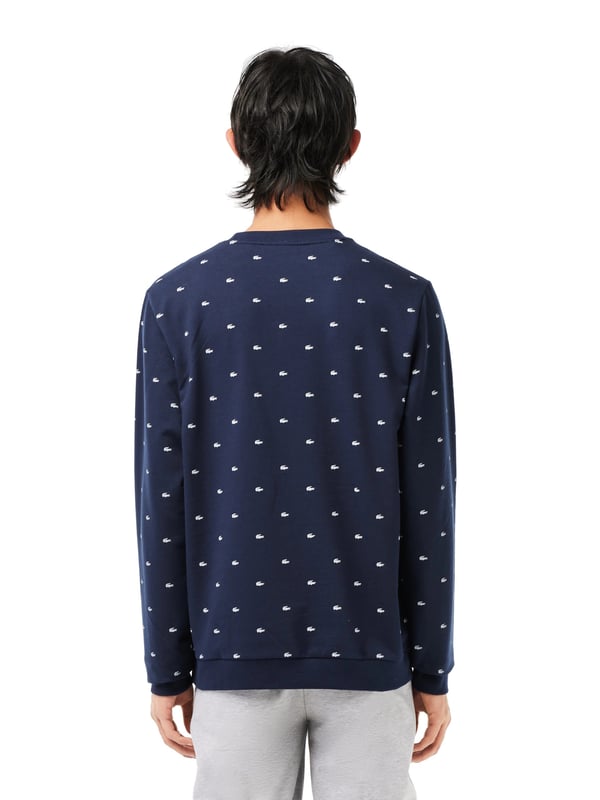 Warm, comfortable and cosy: this cotton fleece sweatshirt will keep you well dressed indoors and out. The round neckline, sleeves and hem are finished with ribbed cuffs. The all-over crocodile print makes this shirt a visual highlight in your closet.