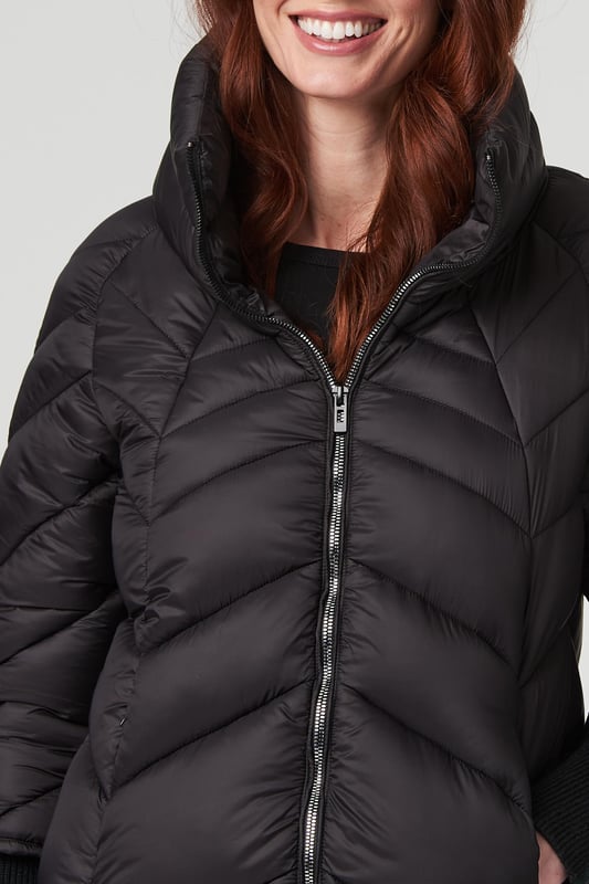 Keep warm but still on-trend with this sleek longline puffer coat. It has a high-necked collar, zip front, long sleeves with wide ribbed cuffs, handy pockets and a thigh length hem. Layer over almost any casual outfit for a practical style you can wear on repeat as it gets colder outside.