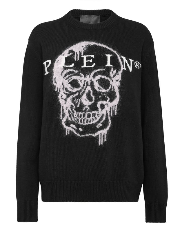 Jersey oversize de lana merina con la incrustación de la Calavera icónica de mohair. Letras de la marca están tejidas en jacquard. Cantos de punto de canalé.