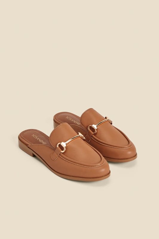 Dress from the feet up
Easy slip-on backless style
Wear-with-everything neutral
Timeless snaffle trim detail
They'll take you from work to weekend
We love them with white denim or linen trousers