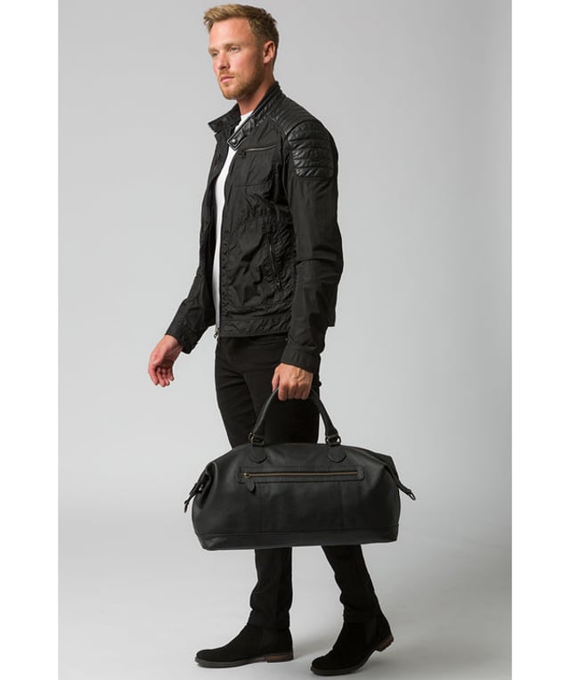 The 'Harbour' holdall from Cultured London is handmade from genuine leather that has a rich texture for a distinct finish and the zip-over top conceals the spacious interior, lined with robust and untreated 100% cotton. A zipped pocket adorns the front of the holdall which is ideal for on-the-go storage and comes with matching leather handles alongside the adjustable and detachable webbed strap, with a drop length of 80cm. Finished with the clean and minimalist embossed Cultured London logo.