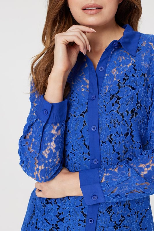 Add a twist to a traditional shirt dress with this sheer lace longline dress. Made from 100% cotton, it has a collar, V-neck, button front, long sleeves with tailored cuffs and a knee length hem. Layer over leggings and pair with your favourite heels, or leave unbuttoned for a chic warm weather alternative to a coat or cardigan.