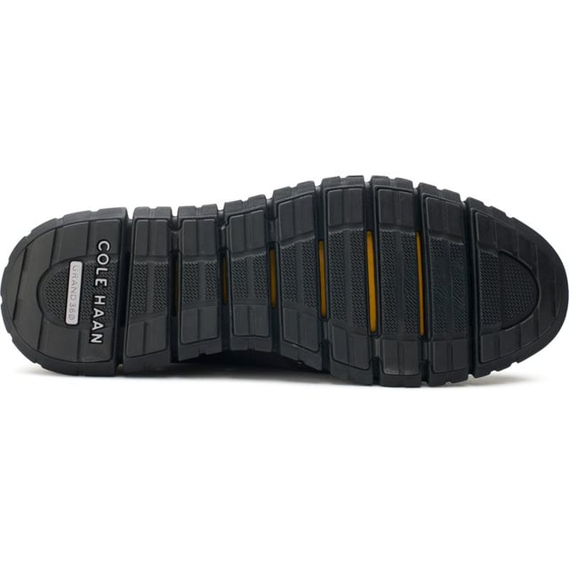 Mens black Cole Haan zerogrand remastered shoes, manufactured with leather and a rubber sole. Featuring: flowerfoam sole, brogue detail, cole haan branding and dandelion rubber.
