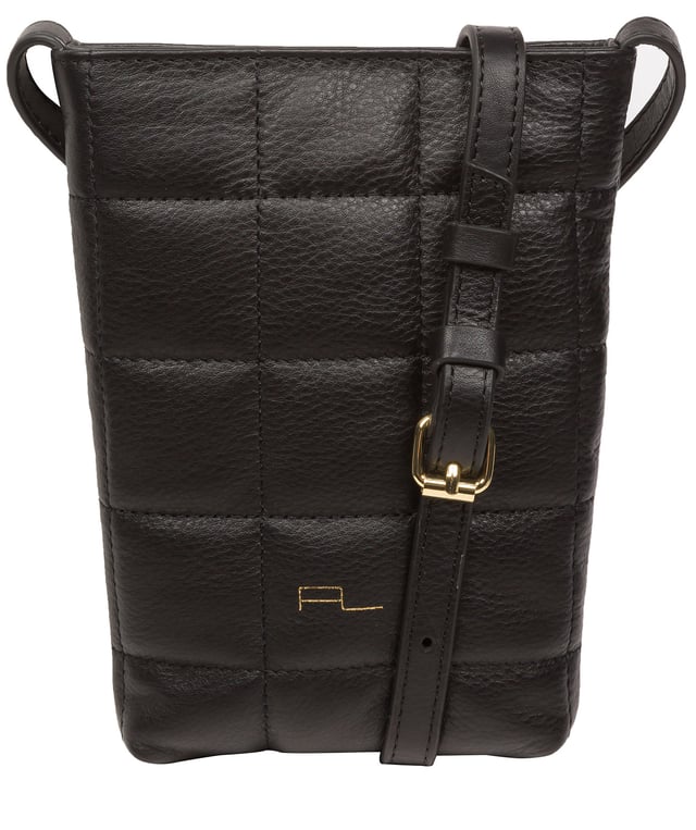 The 'Elouise' cross body phone bag from the Pure Luxuries Marylebone collection is handcrafted from high-quality, genuine Nappa leather with a natural super-soft touch. The eye-catching quilted design on the front gives the bag a unique silhouette, along with extra protection. A concealed magnetic closure keeps the contents of the bag secure. The interior is lined with 100% cotton and includes a slip pocket and two card slots. Comes with a matching and adjustable slim leather strap with a maximum drop length of 65cm. The minimalist Pure Luxuries logo is embossed in gold foil for a beautifully simple finishing touch.
