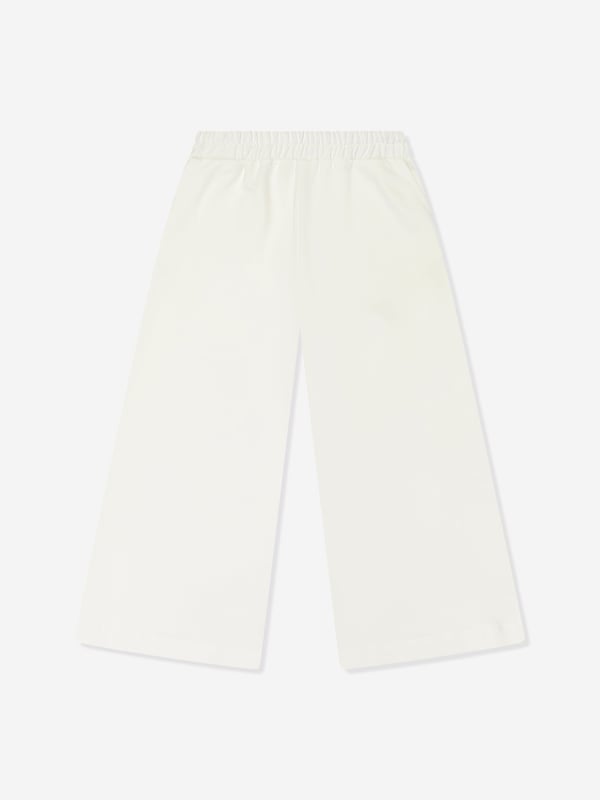 Mama Luma incorporate beautiful eco-friendly materials into their sophisticated handmade constructions. These girls ecru joggers are reflective of the Californian label's precision of beauty. They showcase an elasticated waistband and side pockets for a sleek, effortlessly stylish look. ‚ Handmade‚ 50% Viscose ‚ 45% Polyester ‚ 5% Elastane