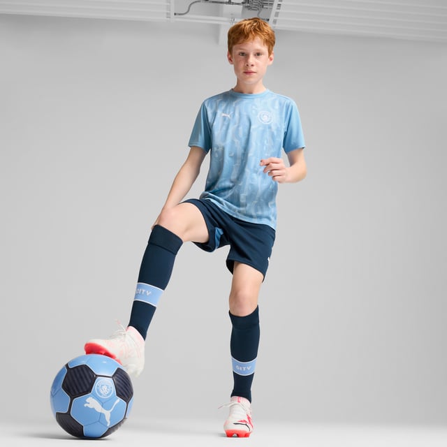 PRODUCT STORY: Train like the champions in this official Manchester City Pre-match Short Sleeve jersey. With a regular-fit, crew neck and our sweat-wicking dryCELL tech, it's tailored for optimal pre-match focus. It features Manchester City details, so you can represent the team with pride. FEATURES & BENEFITS: dryCELL: Performance technology designed to wick moisture from the body and keep you free of sweat during exercise; Made with 100% recycled material excluding trims & decorations. DETAILS: Regular fit; 145 gsm, Jersey; Crew neck; Short sleeves; Official team branding; PUMA Youth: Recommended for older kids between 8 and 16 years.