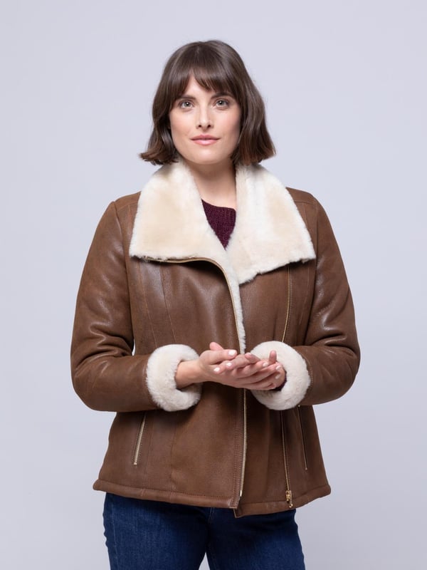 Allerdale Sheepskin Aviator Jacket in Caramel For those wanting to add a little extra glamour to their sheepskin aviator, the Allerdale offers just that. We've taken the classic style, in a rich-caramel hue, and added gold-toned hardware, to elevate the Allerdale. Hand-crafted from 100% sheepskin, this aviator has a nappalan finish, and in time it will develop a crackled vintage effect. Combined with a contrasting white wool, showcased on turn-back cuffs and a chunky collar, this is a distinctive jacket. The styling is incredible, yet nothing should take away from the sheepskin. After all these years it remains our favourite material, offering the perfect balance between form and function. As nature's ultimate insulator it's the first jacket you'll turn to when the temperatures drop. And, it will be with you for years to come.