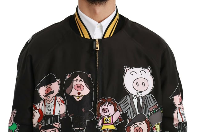 100% Authentic Dolce & Gabbana Bomber Jacket
  Black with multicolor pig motif
  2019 Year of the Pig Family inspired design
  Regular fit with zipper closure
  Two outside pockets and two inside pockets
  Dolce & Gabbana logo details
  Made in Italy with high craftsmanship
  Material: 100% Polyester Lining: 100% Polyester
Material: 100% Polyester