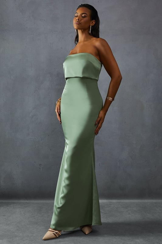Elegant bandeau neckline with overlay detail
        Figure-hugging silhouette for a flattering fit
        Floor-length design perfect for formal occasions
        Luxurious satin fabric for a sophisticated look
        Sleek, strapless style to showcase your shoulders
    
    Make a striking entrance at your next formal event with this stunning bandeau overlay bridesmaid dress from MissPap. The sleek, strapless design features an elegant overlay detail that adds a touch of sophistication to the classic silhouette. The figure-hugging cut accentuates your curves, while the floor-length style ensures a dramatic sweep as you move. Perfect for weddings, galas, or any black-tie affair, this dress is versatile enough to be styled for various occasions. Pair it with strappy heels and statement earrings for a glamorous look, or opt for a delicate necklace and understated clutch for a more refined ensemble. The luxurious satin fabric catches the light beautifully, ensuring you'll shine throughout the evening. Whether you're a bridesmaid or a guest, this dress is sure to turn heads and make you feel like the belle of the ball.