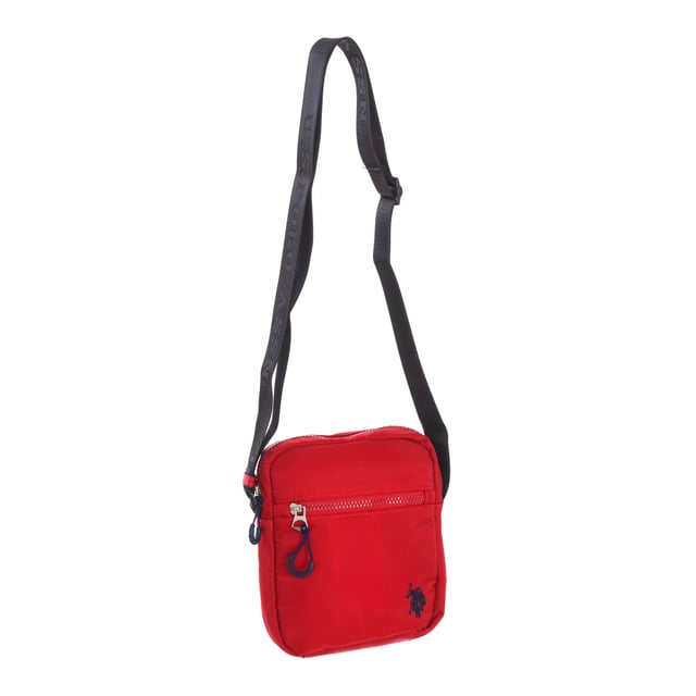 Men's shoulder bag from the U.S. POLO ASSN brand.
 Synthetic material exterior.
 Top zipper closure.
 Zipper pocket on the front and back.
 Back interior: One zipper pocket.
 Adjustable strap with brand print.
 Brand logo on the front.
 Seams seen in tone.
 Measures: 17x20x5.5cm
 Composition: 100% Nylon
 Care:
Clean with a wet cloth.