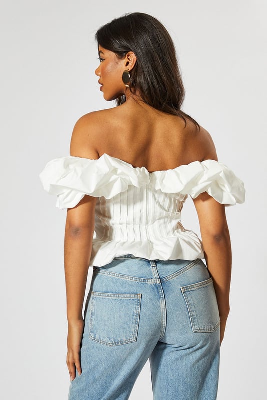 Striking bardot neckline with ruffle detail
        Cinched waist for a flattering silhouette
        Off-shoulder design with short sleeves
        Textured fabric with vertical pleating
        Cropped length perfect for high-waisted bottoms
    
    Make a statement with this eye-catching Ruffle Bardot Cinched Waist Top from MissPap. The off-shoulder design with its dramatic ruffle detail creates a captivating look that's sure to turn heads. The cinched waist accentuates your figure, while the vertical pleating adds texture and interest. Perfect for those who love to be the centre of attention, this top pairs beautifully with high-waisted jeans for a casual yet stylish ensemble. Dress it up with a sleek skirt and heels for a night out, or keep it relaxed with wide-leg trousers and trainers for a chic daytime look. Whether you're heading to a family gathering or meeting friends for drinks, this versatile piece allows you to customise your style to suit any casual occasion. The cropped length is ideal for showing off your favourite bottoms, making it a must-have addition to your wardrobe.