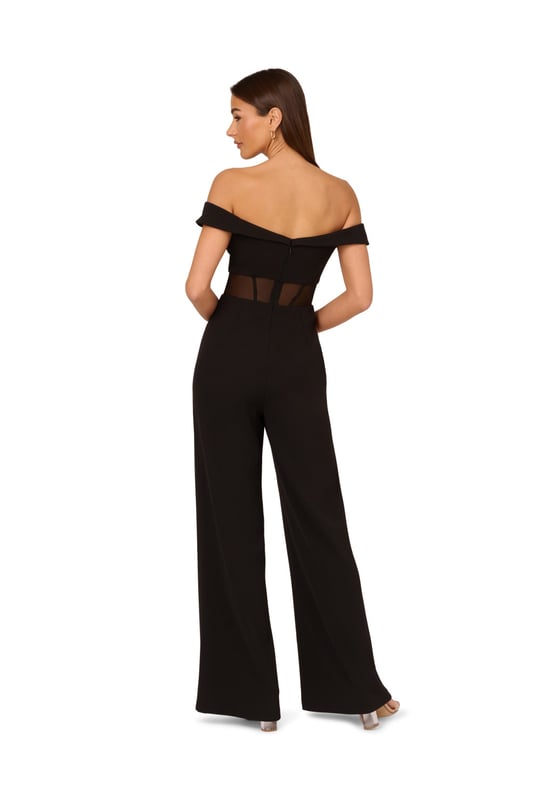 Go boldly to your next event in this sexy jumpsuit. This jumpsuit features an off the shoulder bodice with sweetheart neckline, wide leg trousers, and a sheer panel at the waist with boning construction for a corset effect. Crafted from knit crepe fabric, this eye-catching jumpsuit has some stretch. A stunning choice for every formal or black-tie affair, this off the shoulder jumpsuit is easy to style with your favourite neutral heels and simple metallic jewels. A zipper closure at the centre back completes this corset jumpsuit.