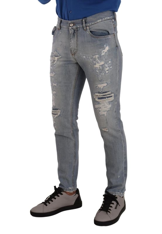 100% Authentic Dolce \u0026 Gabbana tattered denim jeans.\n  Crafted from cotton.\n  Zipper and button closure.\n  Straight fit.\n  Light blue color.\n  Regular fit.\n  Made in Italy.\n  Logo details.\n  Material: 100% Cotton.