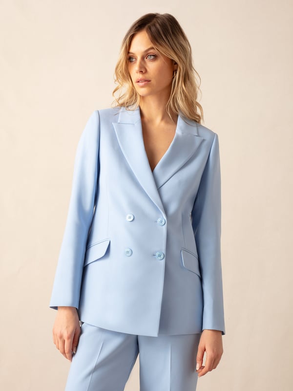 Co-founders' Notes

Introducing our Blue Double-Breasted Blazer, expertly crafted from a viscose blend premium crepe for a luxurious feel. This fully lined blazer showcases a trending blue tone, offering a sophisticated touch to your wardrobe. For a polished ensemble, pair it with matching trousers and a bandeau top, creating a stylish and cohesive look that transitions seamlessly from day to night.

Fully lined

Classic fit
Double breasted design
Classic, standard fit. Try your usual size



Fabric &amp; Care



Composition: Main: 74% Polyester 19% Viscose 7% Elastane Lining: 100% Polyester


Garment Care: Dry Clean Only



Size &amp; Fit


Classic, standard fit. Try your usual size

Length: 74cm (size 10)

Model is 170 cm/5'7" and is wearing a size 10