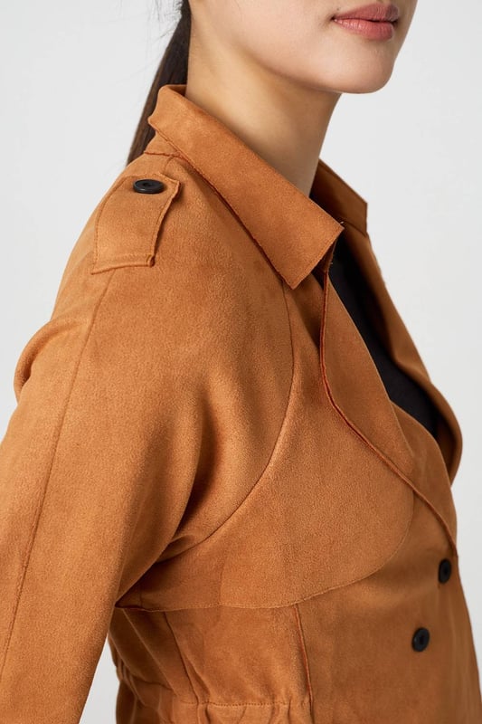 Add an extra layer lo your look with this cropped jacket. It's made from a soft suede feel fabric; and you can wear it over any outfit, including formal dresses or eveningwear. It has a lapel collar and button details, with long sleeves and a fitted shape. Pair this cropped jacket with smart trousers and you can wear it to work too.