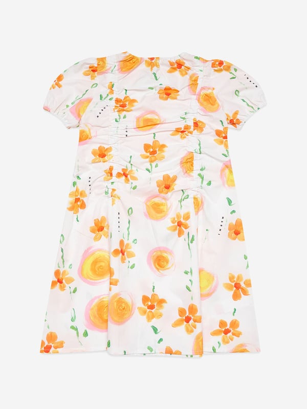 Marni portray dreamy, otherworldly designs in their beautiful handcrafted aesthetics. This girls white poplin dress is a piece to be everlastingly loved. Crafted in high quality cotton with all-over marigold print and orange suns. It showcases balloon sleeves and delicate gathered details.   100% Cotton