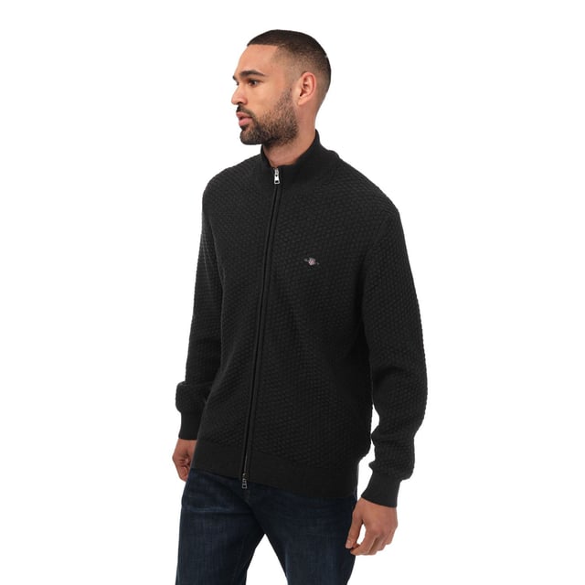 Mens Gant Cotton Zipped Cardigan in charcoal.- Funnel neck.- Full zip fastening.- Rib texture.- GANT logo embroidered at the chest.- Relaxed fit.- 100% Cotton. - Ref: 803017397