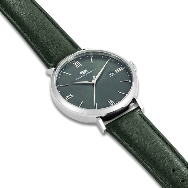 Stylish minimalism inspires from the principles of traditional Horlogerie: This timepiece of the Rhodenwald & Söhne manufacture is an accessory that also scores in demanding men and is often worn in the office and in leisure time. The puristic dial is limited to filigree Roman digits and line indices, a subtle minute and date display. The noble shimmering stainless steel case forms a narrow frame for the dial and nestles elegantly on every wrist. The real leather strap with color -coordinated seam ensures high comfort.