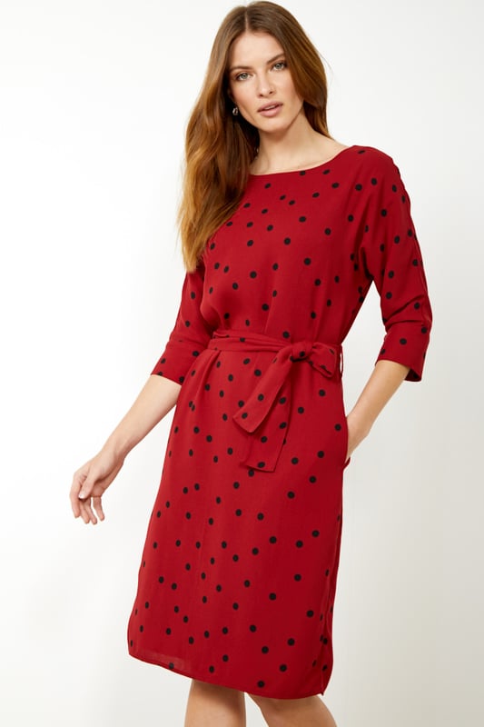 REASONS TO BUY: 

Spots and shift dresses: always in style
Flattering body-skimming fit and 3/4 length sleeves
Tie belt to show off your waist
Pockets, because who doesn't love pockets?
Keep it classic with black court shoes.