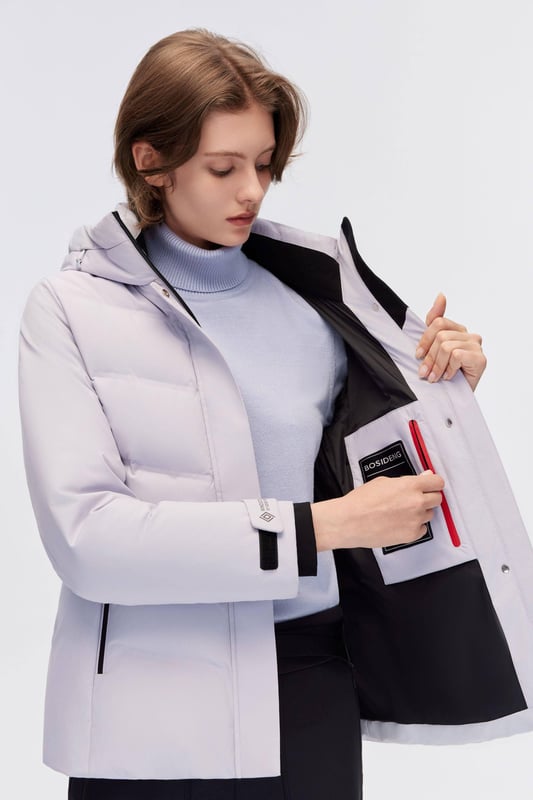 Blends advanced Gore-Tex windproof and waterproof technology with luxurious goose down insulation, offering lightweight warmth and contemporary style for active comfort and protection.