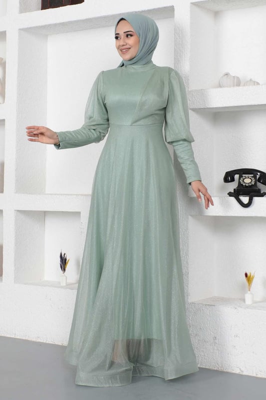 Stoffmerkmal: Hergestellt aus glitzerndem Tüllstoff.Produktmerkmal: Neues Hijab-Modestück der Saison. Gefüttert. Mit einem Rückenreißverschluss für einfaches Anziehen. Mit einem Reißverschluss verziert. Aufgrund von Konzeptaufnahmen kann es leichte Farbabweichungen im Produkt geben. Das Model trägt Größe 38. Größe 38 Abendkleid Maße: Produktlänge: 146 cm - Br