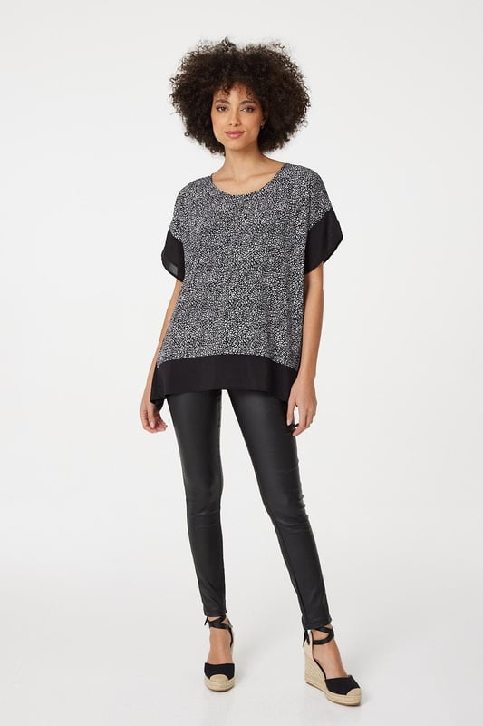 Make a statement with this leopard print poncho blouse top. It has a round neck, short sleeves, an oversized fit and a thigh length hem. Pair with fitted trousers and heeled wedges for a standout style that's perfect for date night or drinks with the girls.