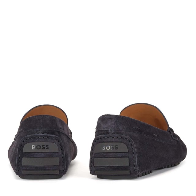 Men's Boss Driver Moccasin Shoes in Dark Blue Mens BOSS Driver Moccasin Shoes in dark blue.- Made in Italy.- Full suede upper design for a casual look.- Trimmed with seasonal chord hardware on the vamp. - Rubberised injected outsole and a cognac-leather lining delivers elevated comfort in every step.- Ref: 50472511-401