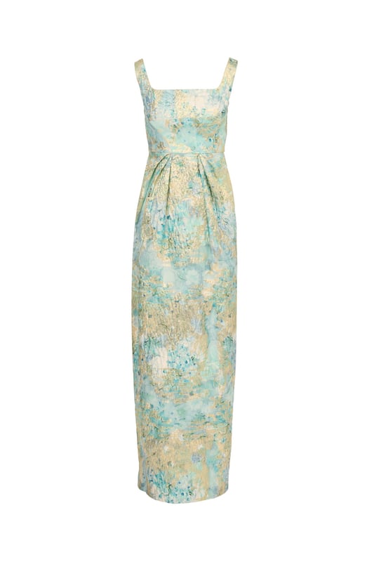 Fine fabrication and elegant details make this floral gown stand above the rest. This floral dress features a fitted bodice with square neckline and tank straps, a floor-skimming skirt with a slit at the back, and pleated details at the waist that shows off the figure. Crafted from woven metallic jacquard fabric source from Korea, this dress is decked out in beautiful floral print. A low back and hidden zipper closure are the final details that make this evening gown shine. Styled with nude heels and sparkling jewelery, this floral gown is perfect for a formal or black-tie event.