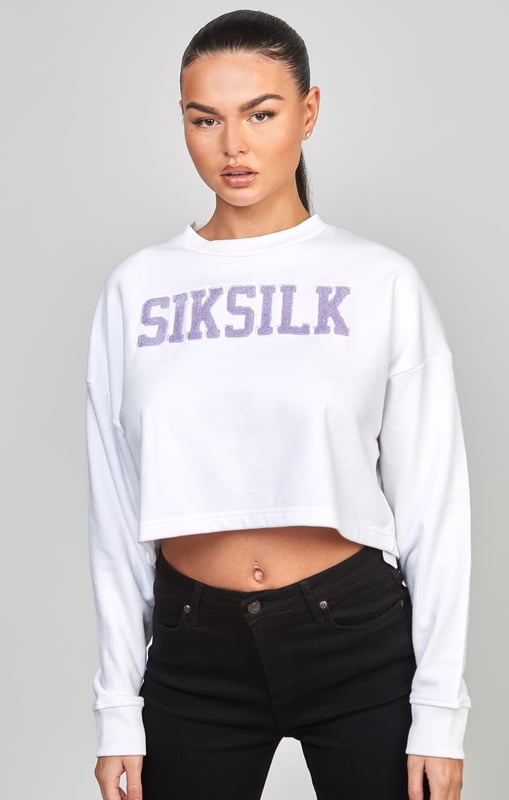 inchWhite Crop Varsity SweatshirtSoft touch fabricCropped fitEmbroidered logoCrew neckAppliqueLong sleeveMachine wash80% Cotton 20% Polyester Loopback inch