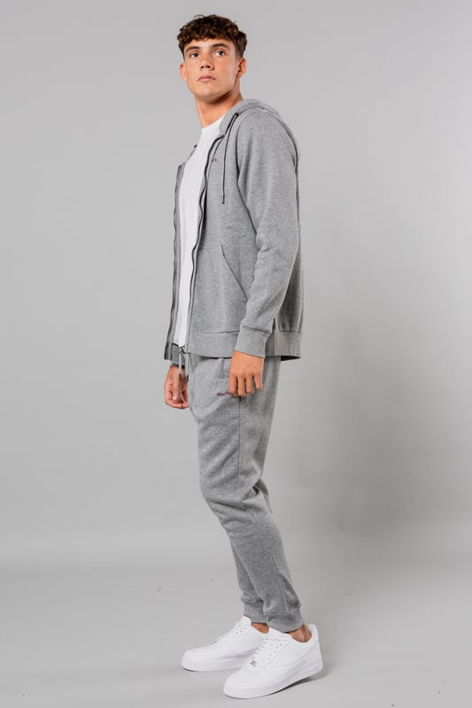 Stay cosy and comfortable in this zip-through hoody and jogger set from Tokyo Laundry. This set features a drawstring waist and a drawcord hood for a perfect, adjustable fit. The kangaroo pocket adds functionality to the stylish design. The fabric is a cotton mix and is machine washable for easy care. This set is a must-have for casual and loungewear.