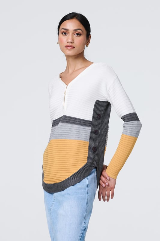 Mustard Colour Block Zip Detail V-Neck Jumper You'll feel comfortable and look stylish in this jumper. It's made from a soft viscose blend that will ensure you stay warm, even on a cool day. It also has a zip detail v-neck, buttons on the side and a modern curved hem. It has a relaxed slim fit with long sleeves and a ribbed knit material.
