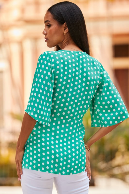 REASONS TO BUY:

Your jeans deserve it
Nothing flatters like a wrap top
Gorgeous draped sleeves
Polka dots: forever on-trend
It's work smart, weekend chic
Just add white jeans